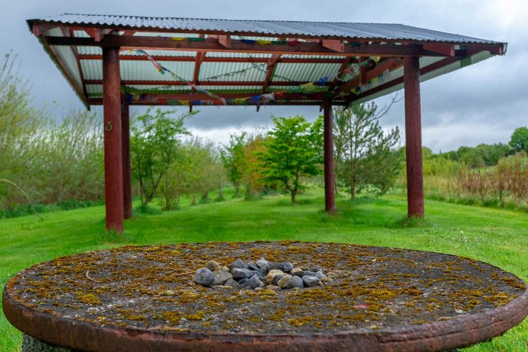 spell tabe outside with beautiful green surrounds